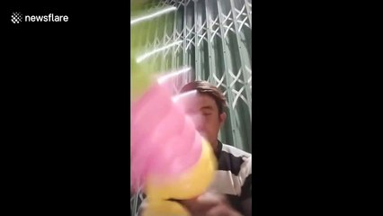 Vietnamese man makes balloon toy he inflated with nose