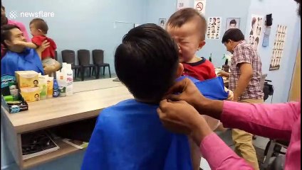 Every parent will relate to this footage of a screaming toddler getting his hair cut