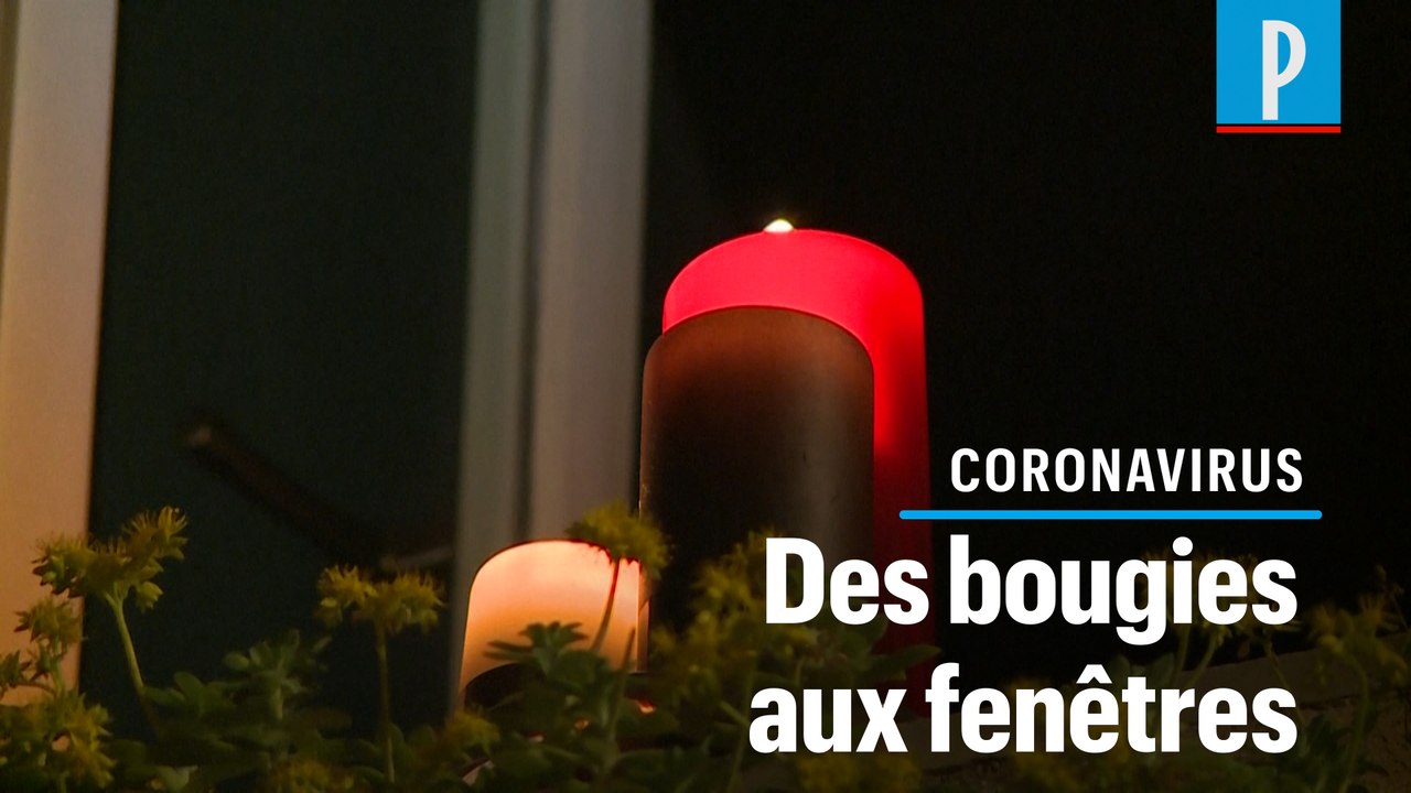 A Rome, les confinés allument des bougies à leurs fenêtres