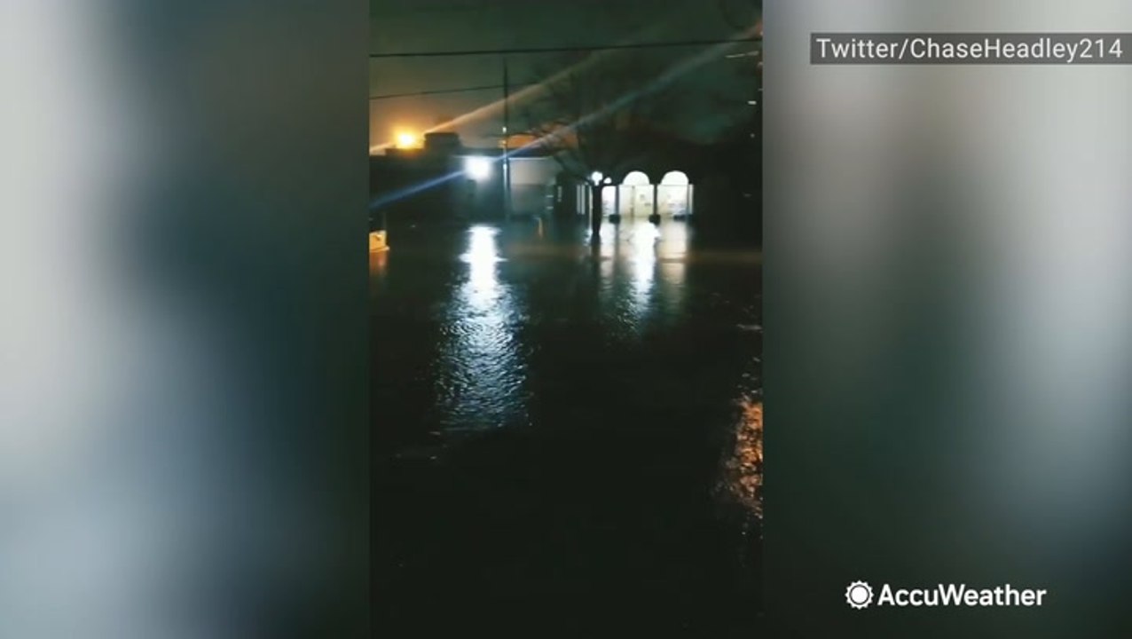 Cars underwater as flash flooding sweeps throug...