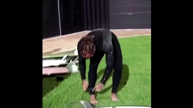 Lewis Hamilton hits the surf Down Under after Australian Grand Prix cancelled