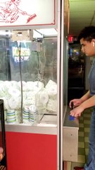 Guy Smartly Uses Handle to Win Toilet Paper From Claw Machin