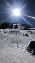 Girl Jumps Off Snow Ramp While Skiing and Faceplants Hard on