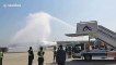 Chinese airport welcomes home flight carrying coronavirus medical workers with water arch