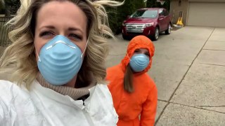 Family of Four and Dog Dress Up in Hazmat Suits and Head Out