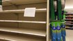 People Shop Food Items Leaving Shelves Empty at Store in Haw