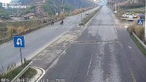 Distracted motorist in China crashes into pedestrian walking across road with handcart