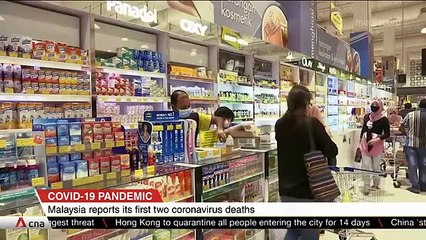 Malaysia reports first two COVID-19 deaths as country enters partial lockdown