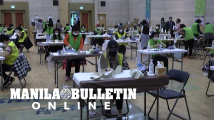Seoul mask production line overwhelmed by volunteers