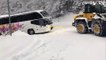 The tourist bus in the Zoldo valley towed on the snowy curves