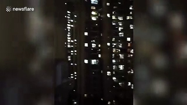 Residents sing Chinese national anthem out of windows to celebrate no increase in Wuhan coronavirus cases