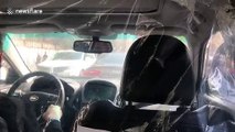 Coronavirus: Shanghai taxi driver uses plastic curtain to separate himself from passengers