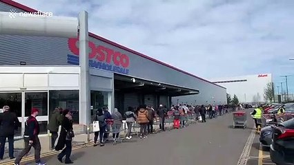 Insane queues outside UK Costco as customers ignore government warning not to "panic buy"