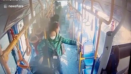 Car explodes beside bus in China, shattering windows and injuring passengers