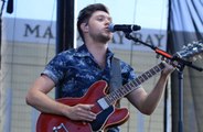 Niall Horan doesn't talk to 1D bandmates about music