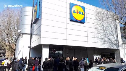 UK panic-buyers crowd London supermarket and smash eggs in rush to nab produce