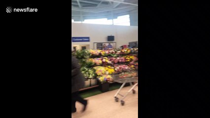 NHS workers applauded and handed flowers at Tesco in Belfast