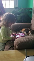 Little Girl Draws Picture of Cat And Shows Kitten
