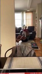 Dad Lifts Baby as Weight for Home Workout While Practicing S