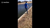 Impressive hit! Man in Nebraska hits a golf shot on the edge of the water