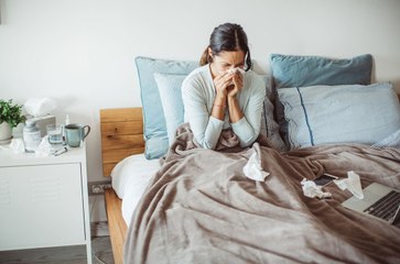 Sleeping In Can Boost Your Immune System, According to This Doctor