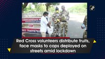 Red Cross volunteers distribute fruits, face masks to cops deployed on streets amid lockdown
