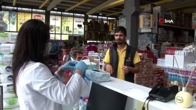 Hastane gibi market...Bu markette önce alışveriş değil, sağlık için önlem alınıyor