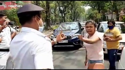 Furious Indian woman LICKS COP after being stopped for defying COVID-19 lockdown