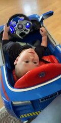 Kiddo Driving Car While Laying Down
