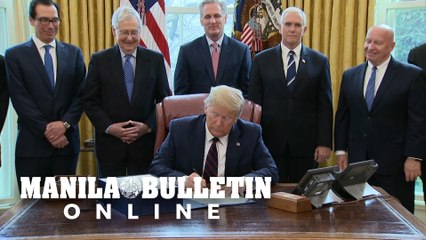 Trump signs $2 trillion rescue plan for virus-hit US economy