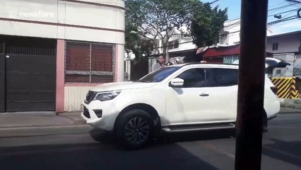 Drone sprays sterilising liquid over Philippines streets during coronavirus lockdown