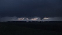 Multiple funnel clouds pop up across the horizon