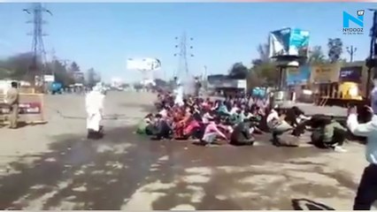 Watch: Migrant workers sprayed with disinfectant in UP