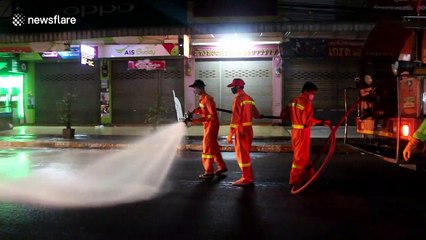 Trucks spray food markets with disinfectant to stop COVID-19 in Thailand
