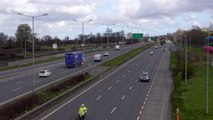 Irish police and Defence Forces escort convoy loaded with protective gear through Dublin