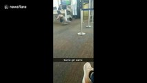 Hilarious fail when a woman at the airport in California trips and falls