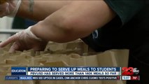 Preparing to serve up meals to students