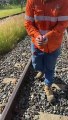 Workers Help Lost Ducks Cross Railroad Tracks