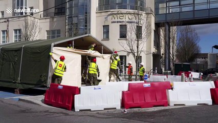 Irish Army set up tents outside Cork hospital to combat COVID-19 pandemic