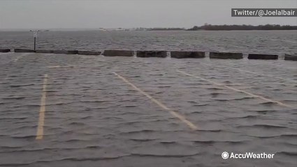 Streets along coast flood amid pounding surf