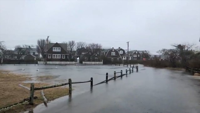 Floodwaters bury roads in Massachusetts