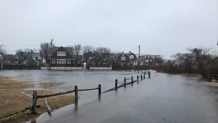 Floodwaters bury roads in Massachusetts