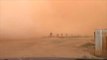 Massive wall of dust sweeps over fields