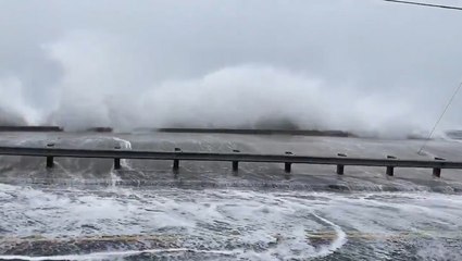 Coastal flooding spills inland as waves slam ashore