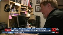 Local Musician uplifts neighbors with mini concert through his window