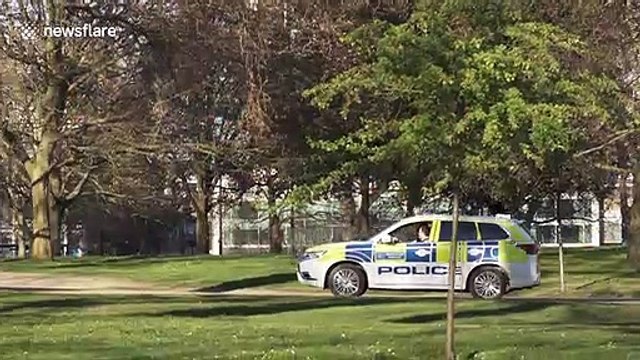 Police try to enforce social distancing in Hyde Park in London during coronavirus lockdown