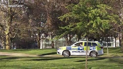 Police try to enforce social distancing in Hyde Park in London during coronavirus lockdown