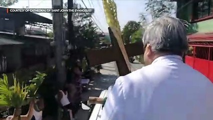 Archbishop Villegas drives through streets to bless 'palaspas'