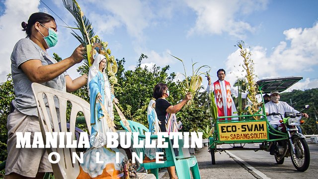 Filipino Catholics celebrate 'mobile blessings' on Palm Sunday amid COVID-19 threat