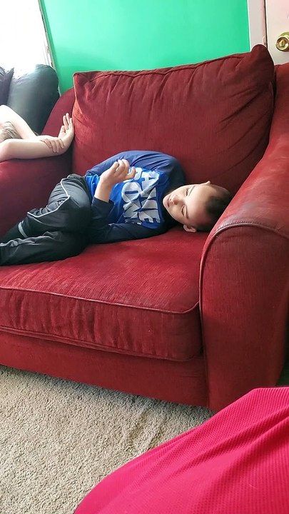 Child Watches Wiggles While Siblings Look On Upset